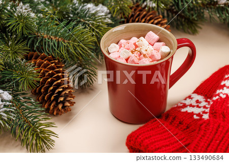 Cup with marshmallows, snowy fir branches Cup with marshmallows, snowy fir branches 133490684