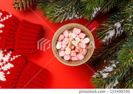 Gift box, cup with marshmallows, snowy fir branches 133490700
