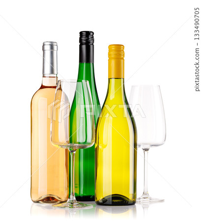 Different wine bottles and glasses on white background Different wine bottles and glasses on white background 133490705
