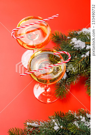 Champagne glasses and snowy fir branches 133490732