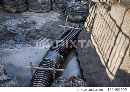 Civil engineering drainage pipes at construction sites 133490895