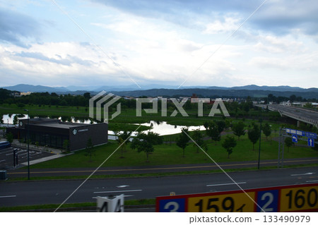 View of the area between stations from Asahikawa Station on the JR Hokkaido Furano Line (early morning in summer 2023) View of the area between stations from Asahikawa Station on the JR Hokkaido Furano Line (early morning in summer 2023) 133490979