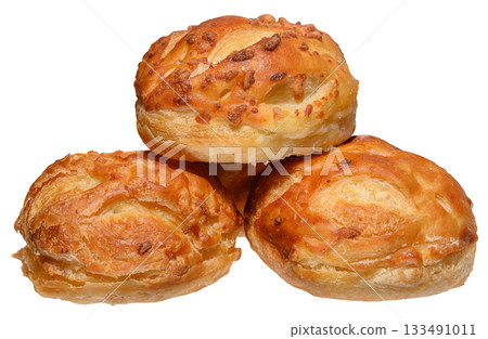 Stack of baked round filled puff pastry buns on isolated background Stack of baked round filled puff pastry buns on isolated background 133491011