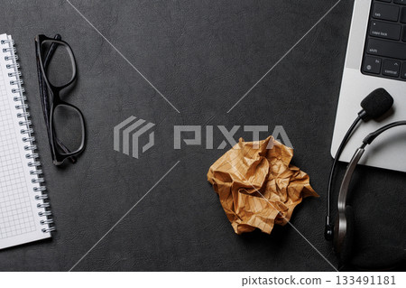 Office supplies and laptop on black leather workspace, top view with copy space Office supplies and laptop on black leather workspace, top view with copy space 133491181
