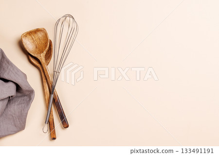 Kitchen utensils on beige table Kitchen utensils on beige table 133491191