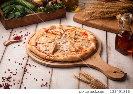 Chicken mushroom pizza on wooden board Chicken mushroom pizza on wooden board 133491816