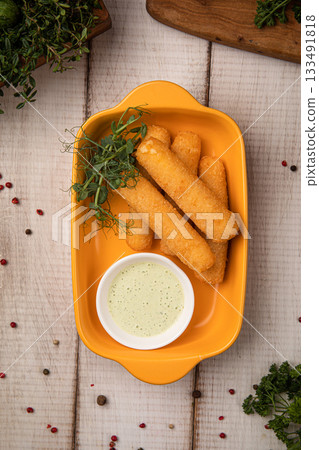 Crispy mozzarella sticks with dipping sauce Crispy mozzarella sticks with dipping sauce 133491818