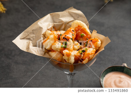 Crispy shrimp bites served with creamy sauce 133491860