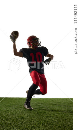 American football player in dynamic throwing pose with powerful emotion isolated on white background 133492135