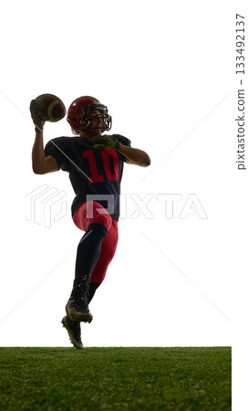 American football player preparing strong throw with concentrated emotion isolated on white background American football player preparing strong throw with concentrated emotion isolated on white background 133492137