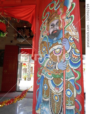 Vibrant Guardian Deity A Traditional Chinese Wall Mural Depicting a Mythical Protector 133492294