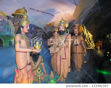 Colorful Statue Scene Depicting Figures in Traditional Clothing 133492307