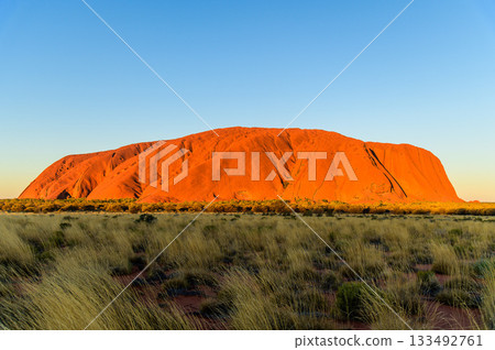 A stunning sunset view of Ayers Rock A stunning sunset view of Ayers Rock 133492761