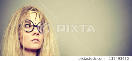 Tired crazy woman after intensive thinking 133493410