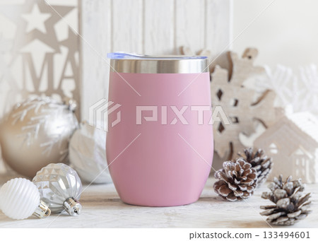 Blank pink Stainless Steel wine tumbler near Christmas baubles and decor on table, mockup Blank pink Stainless Steel wine tumbler near Christmas baubles and decor on table, mockup 133494601