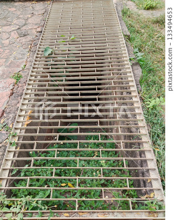 underground stairs safety locked by iron mesh door 133494653