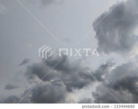 rain season clouds. Gray rain clouds loaded with rain in the sky. 133494680