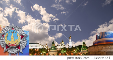 Moscow Kremlin (with decorations for the holiday of May 9 in honor of Victory Day celebration (WWII). Against the sky with clouds, Russia. TRANSLATION: USSR, Victory! 133494831
