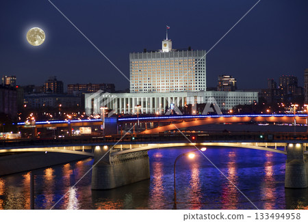 Moscow, Russia. View from the embankment of the Moskva River.  Borodinsky bridge, Smolensky Metro Bridge and White House of Russia behind it (at night with the super moon) 133494958
