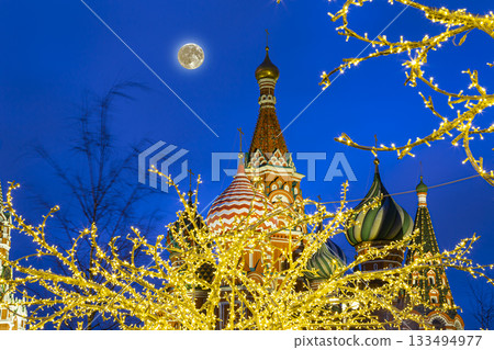 Saint Basil cathedral (Temple of Basil the Blessed) and Christmas (New Year holidays) decoration, Red Square, Moscow, Russia (at night with the super moon). Journey to Christmas, Moscow seasons 133494977