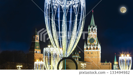 Christmas (New Year holidays) decoration in Moscow (at night with the super moon), Russia-- The Spasskaya Tower. Journey to Christmas, Moscow seasons. View from Zaryadye Park 133494982