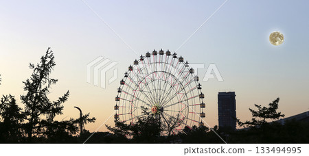 Ferris Wheel (Night view). VDNKh (All-Russia Exhibition Centre) is a permanent general-purpose trade show in Moscow, Russia, at night with the super moon Ferris Wheel (Night view). VDNKh (All-Russia Exhibition Centre) is a permanent general-purpose trade show in Moscow, Russia, at night with the super moon 133494995