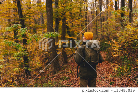 Man Traveler Walking on Autumn Forest Path 133495039