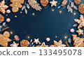Luxurious Christmas frame of gilded gingerbread, fir branches, and glowing stars on a deep navy blue background 133495078