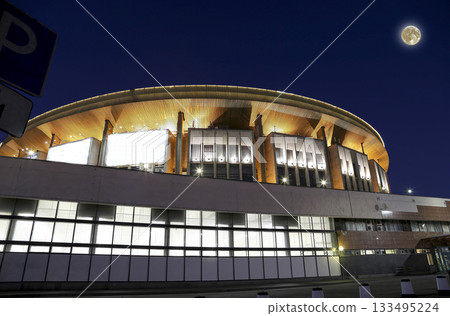 Olympic Stadium building (at night with the super moon) in Moscow, Russia. Olympic is one of the largest indoor sports and concert complex in Russia and Europe Olympic Stadium building (at night with the super moon) in Moscow, Russia. Olympic is one of the largest indoor sports and concert complex in Russia and Europe 133495224
