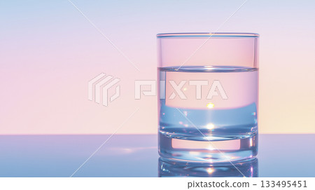 glass half-filled with glowing fluid, neon-lit abstract background 133495451