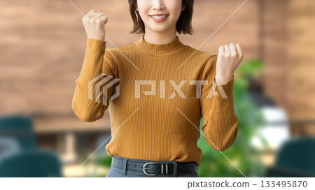Woman/businesswoman doing a fist pump Woman/businesswoman doing a fist pump 133495870