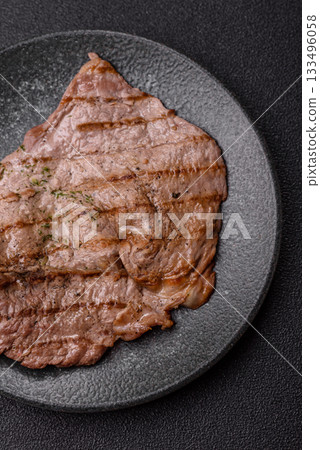 Grilled beef steak, meat cooked on barbecue with salt and pepper. Grilled beef steak Grilled beef steak, meat cooked on barbecue with salt and pepper. Grilled beef steak 133496058