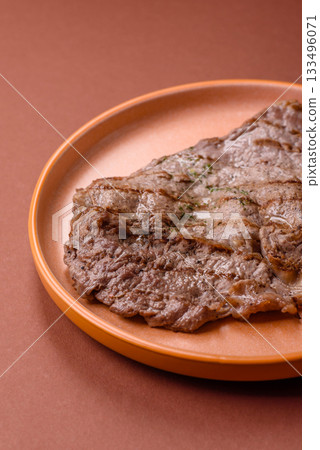 Grilled beef steak, meat cooked on barbecue with salt and pepper. Grilled beef steak Grilled beef steak, meat cooked on barbecue with salt and pepper. Grilled beef steak 133496071