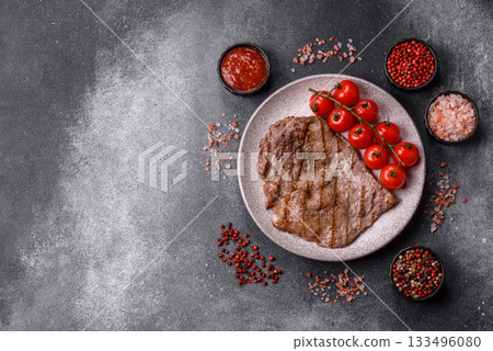 Grilled beef steak, meat cooked on barbecue with salt and pepper. Grilled beef steak Grilled beef steak, meat cooked on barbecue with salt and pepper. Grilled beef steak 133496080