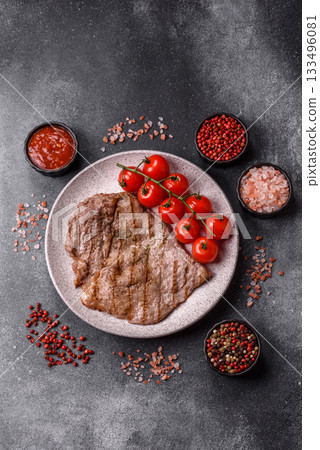 Grilled beef steak, meat cooked on barbecue with salt and pepper. Grilled beef steak Grilled beef steak, meat cooked on barbecue with salt and pepper. Grilled beef steak 133496081