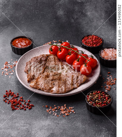 Grilled beef steak, meat cooked on barbecue with salt and pepper. Grilled beef steak Grilled beef steak, meat cooked on barbecue with salt and pepper. Grilled beef steak 133496082