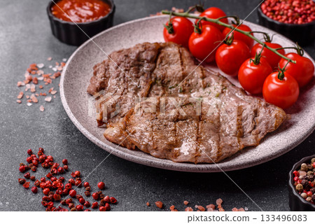 Grilled beef steak, meat cooked on barbecue with salt and pepper. Grilled beef steak Grilled beef steak, meat cooked on barbecue with salt and pepper. Grilled beef steak 133496083