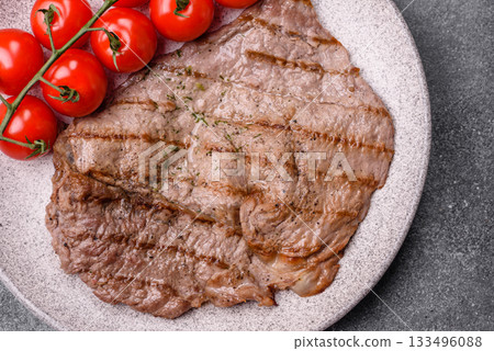 Grilled beef steak, meat cooked on barbecue with salt and pepper. Grilled beef steak 133496088