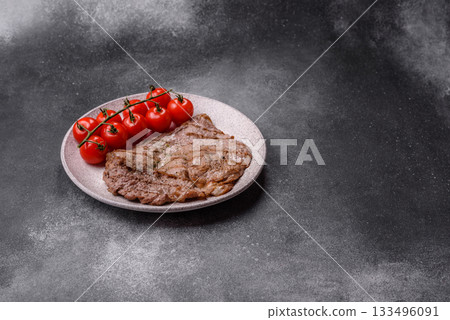 Grilled beef steak, meat cooked on barbecue with salt and pepper. Grilled beef steak 133496091