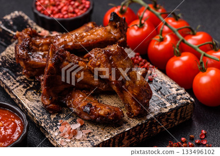 Grilled beef or pork ribs, meat cooked on a barbecue with salt and pepper. Grilled ribs 133496102