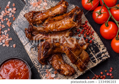 Grilled beef or pork ribs, meat cooked on a barbecue with salt and pepper. Grilled ribs 133496103