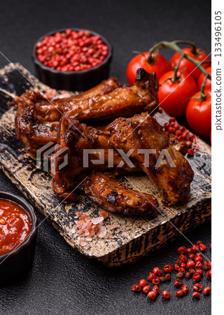 Grilled beef or pork ribs, meat cooked on a barbecue with salt and pepper. Grilled ribs Grilled beef or pork ribs, meat cooked on a barbecue with salt and pepper. Grilled ribs 133496105