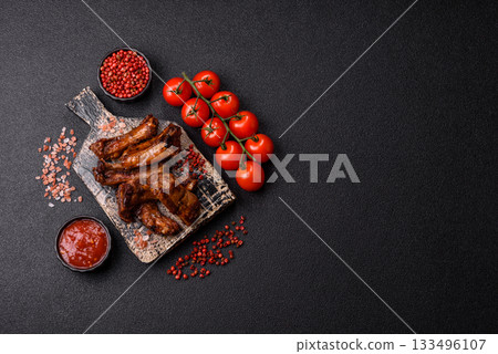 Grilled beef or pork ribs, meat cooked on a barbecue with salt and pepper. Grilled ribs 133496107
