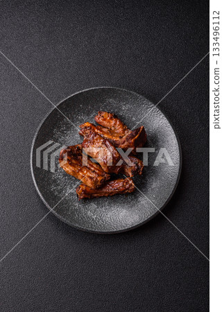 Grilled beef or pork ribs, meat cooked on a barbecue with salt and pepper. Grilled ribs 133496112