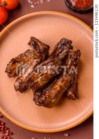 Grilled beef or pork ribs, meat cooked on a barbecue with salt and pepper. Grilled ribs 133496130