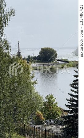 Scenic river view with park and monument in the distance, ideal for nature background Scenic river view with park and monument in the distance, ideal for nature background 133496423