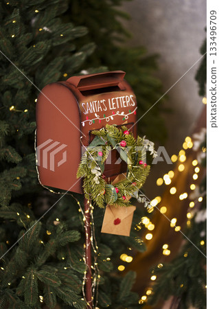Red Santa mailbox with wreath and envelope 133496709