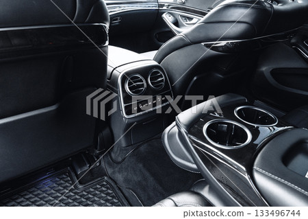 Luxury vehicle interior with premium seating and sleek design 133496744
