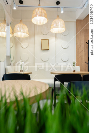 Elegant cafe interior with soft lighting and simple decor in a cozy setting 133496749
