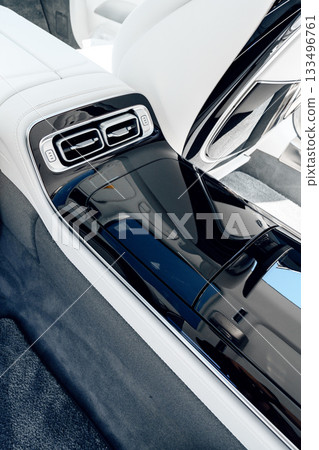 Modern car interior featuring sleek design and luxurious materials in a stylish setting Modern car interior featuring sleek design and luxurious materials in a stylish setting 133496761